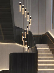 Modern staircase with hanging lights in a sleek interior setting
