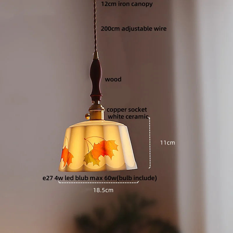 Pendant light with leaf design, labeled dimensions and materials on a neutral background