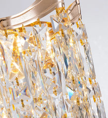 Close-up of a gold and crystal chandelier