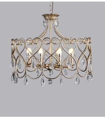 Gold chandelier with crystal accents on a gray background