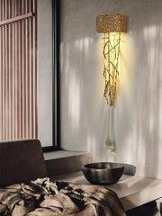 Decorative floor lamp with natural branch design in a modern interior setting.