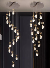 Modern chandelier with hanging crystal elements against a dark background