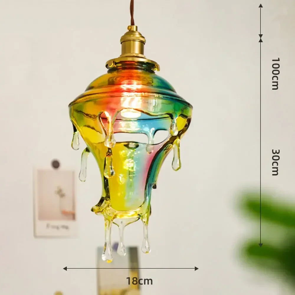 Colorful glass pendant light with measurements on a plain background