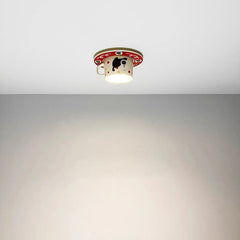 Ceramic coffee cup ceiling light casting a warm glow in a hallway setting