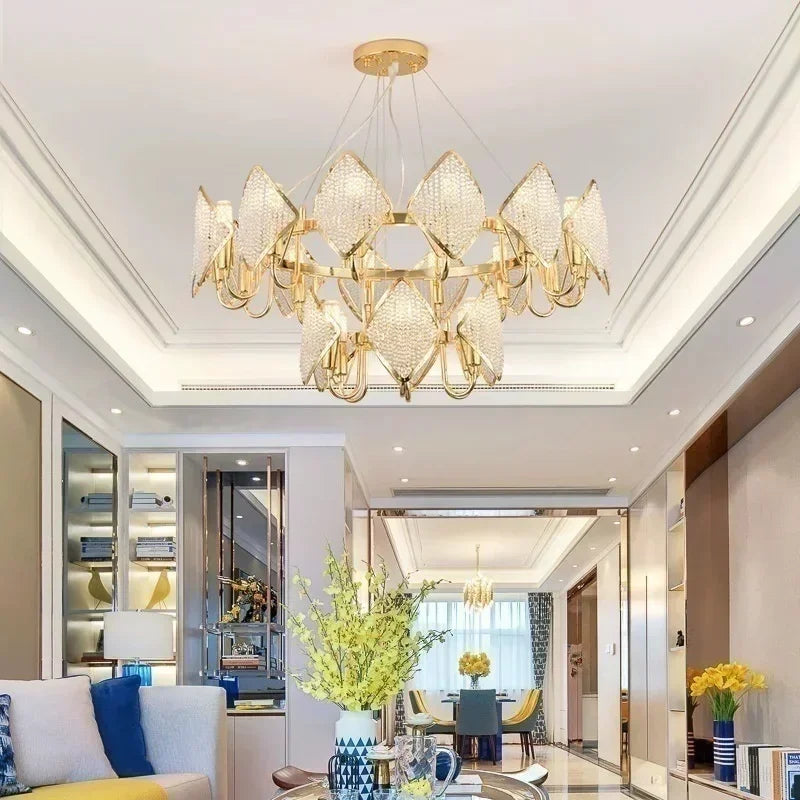 Interior view of a modern living room featuring a prominent gold crystal chandelier.
