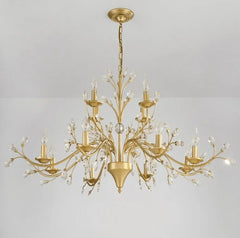 Gold chandelier with crystal accents on a gray background