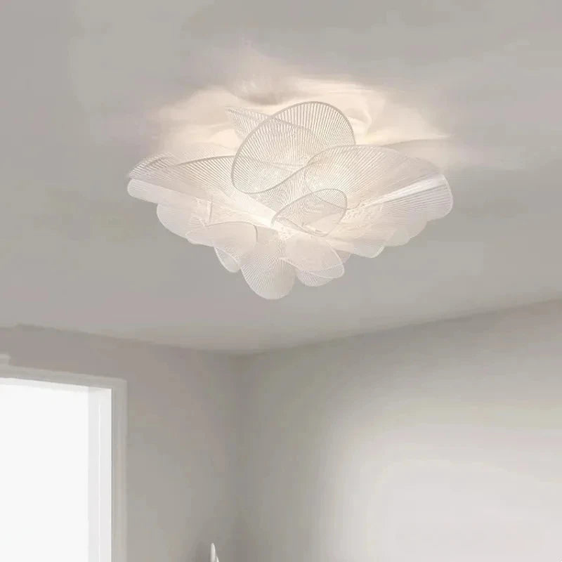 Ceiling light fixture in a room with neutral walls and a window.