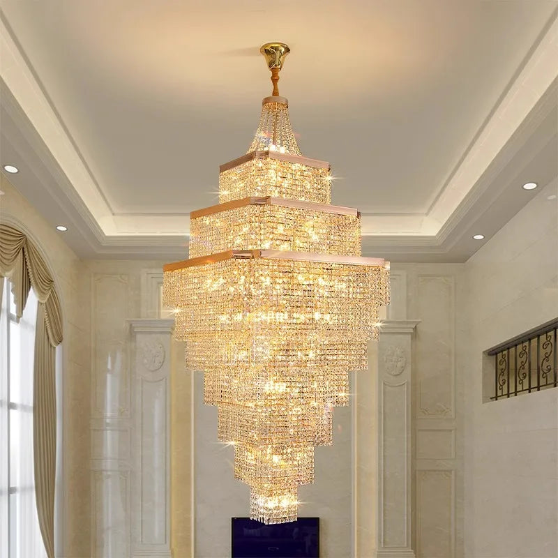 Luxurious chandelier hanging in a room with white walls and a window.