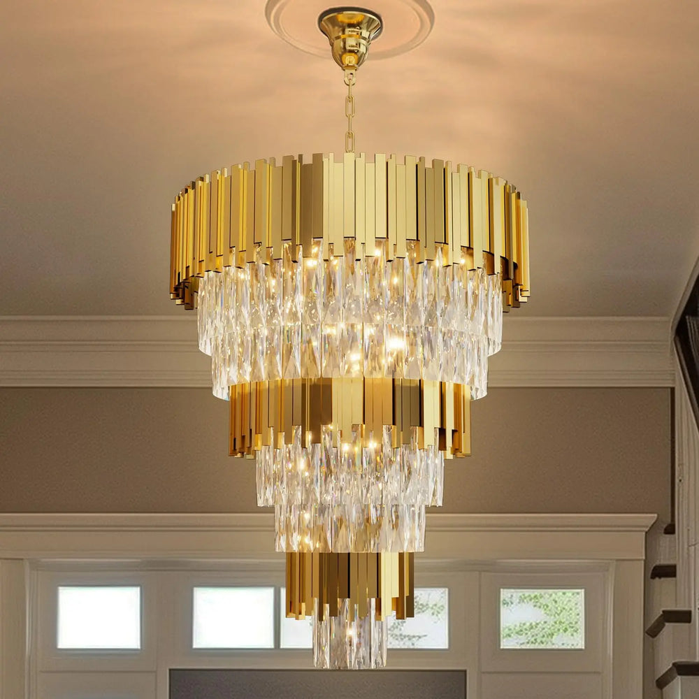 Gold chandelier hanging in a room with windows