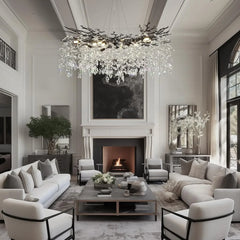 Modern living room with a chandelier, fireplace, and comfortable seating.