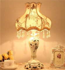 Decorative table lamp with floral design on a warm background