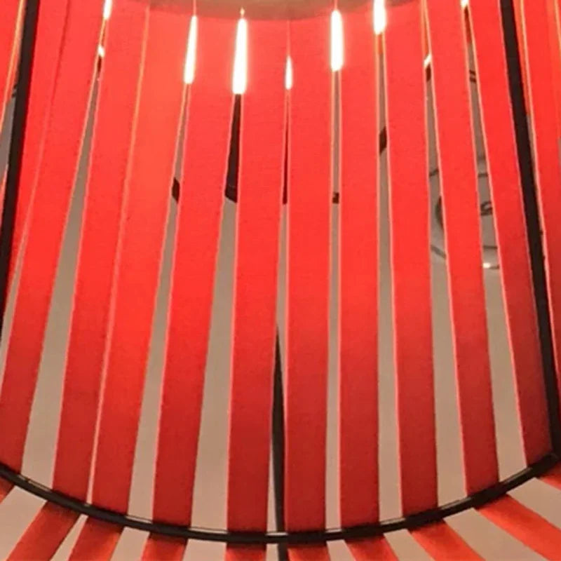 Close-up of a red and white striped fabric with a black border.