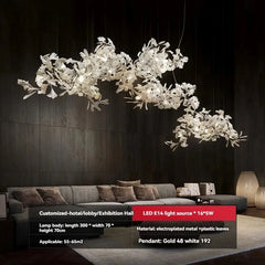 Modern chandelier hanging above a sofa in a dimly lit room
