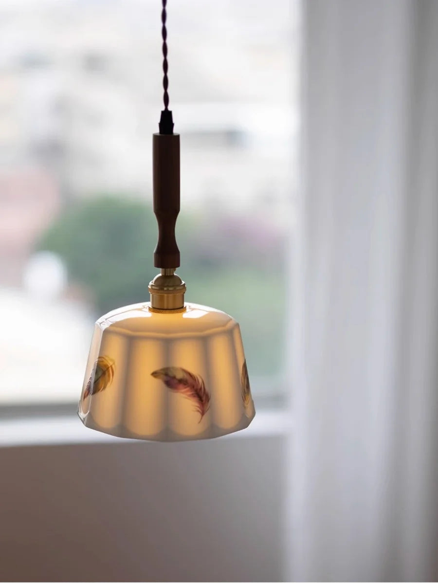 Decorative pendant light with floral design in a softly blurred indoor setting