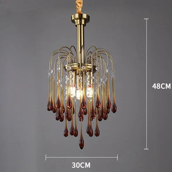 Chandelier with decorative glass droplets on a gray background