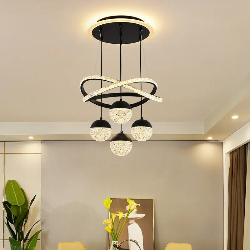 Modern ceiling light fixture in a room with decor elements.