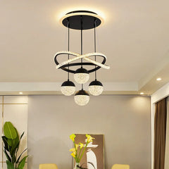 Modern ceiling light fixture in a room with decor elements.
