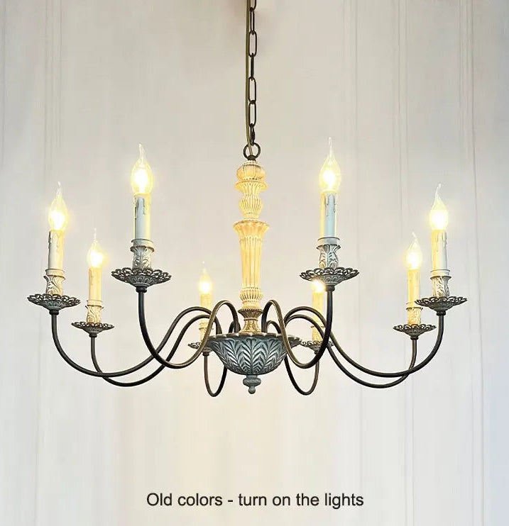 Vintage-style chandelier with multiple candle-like lights on a white background
