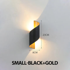 Black and gold wall light fixture on a gray wall with dimensions indicated.