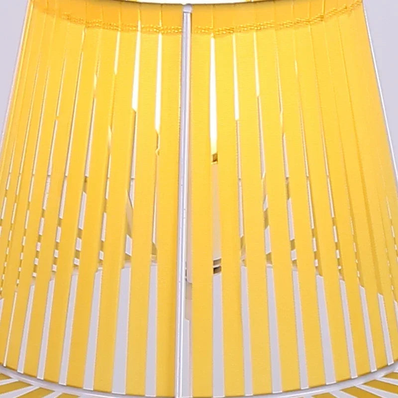 Close-up of a yellow and white striped fabric with a plain background