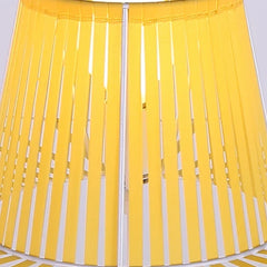 Close-up of a yellow and white striped fabric with a plain background