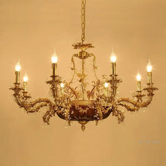 Gold chandelier with multiple lights on a beige background
