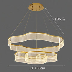 Gold chandelier with dimensions on a dark background