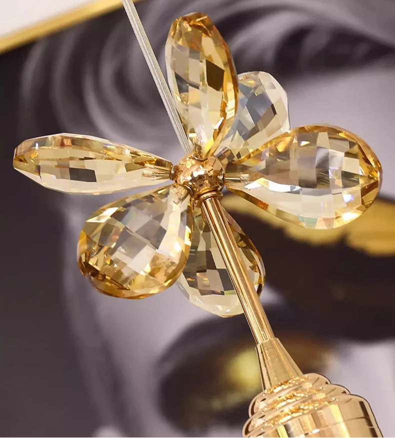 Close-up of a gold and crystal decorative item with a blurred background