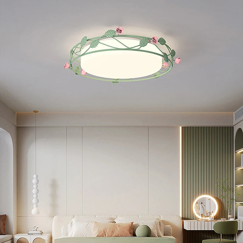 Interior view of a bedroom with a green floral flush mount ceiling light installed.