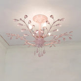 Pink floral semi-flush ceiling light with crystal accents mounted on a white ceiling.