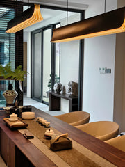 Modern interior with a wooden table, chairs, and decorative items.