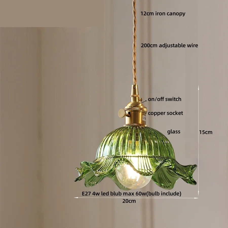 Green pendant light with labeled components on a beige background