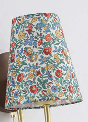 Colorful floral-patterned lampshade on a white background