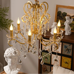Gold chandelier with crystal accents in a decorative setting
