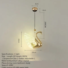 Gold swan-shaped pendant light with dimensions on a gray background