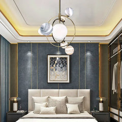 Modern bedroom with a chandelier, bed, and wall art