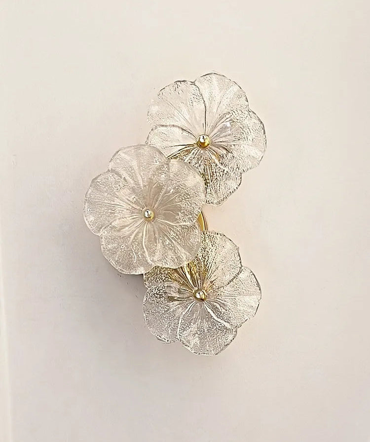 Decorative wall art with floral designs on a plain background