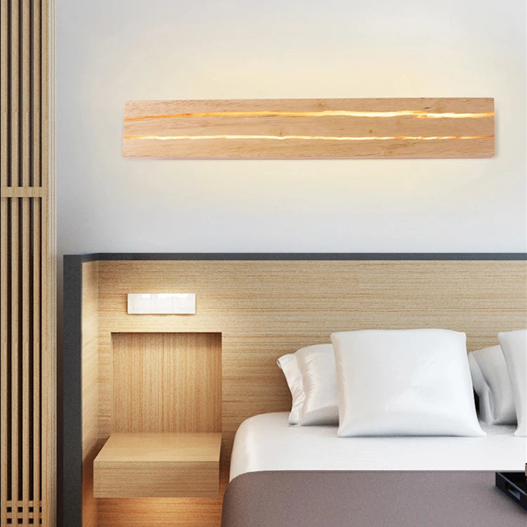 Modern bedroom with wooden headboard and wall lights
