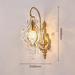 A gold crystal wall sconce with dimensions indicated: height 400mm and diameter 180mm, displayed against a softly lit wall.