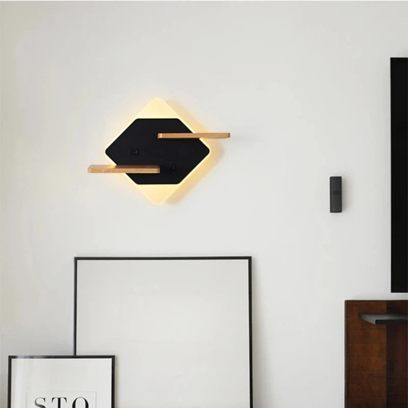 Diamond-shaped wall sconce with wood shelves and USB port mounted on a white wall above framed art.