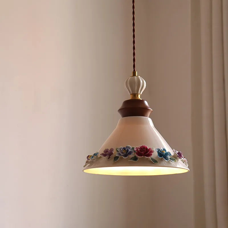 Pendant light with floral design on a plain background