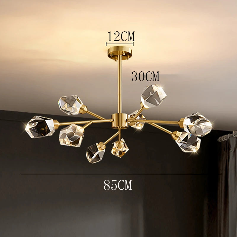 Gold chandelier with crystal-like fixtures on a dark background
