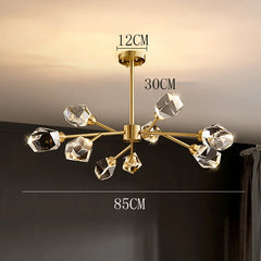 Gold chandelier with crystal-like fixtures on a dark background
