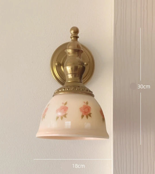 Wall-mounted lamp with floral design on a neutral background