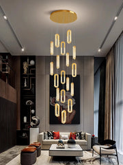 Modern living room with a stylish chandelier, sofa, and decor.