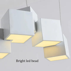 Modern ceiling light fixture with geometric design on a plain background