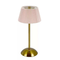 Table lamp with pink pleated shade and gold base on a white background