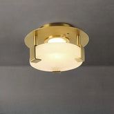 Gold geometric flush mount ceiling light with frosted glass diffuser and crystal accents, viewed from below.