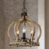 Close-up view of a rustic wood crown-shaped chandelier with three candle-style LED bulbs against a brick wall.