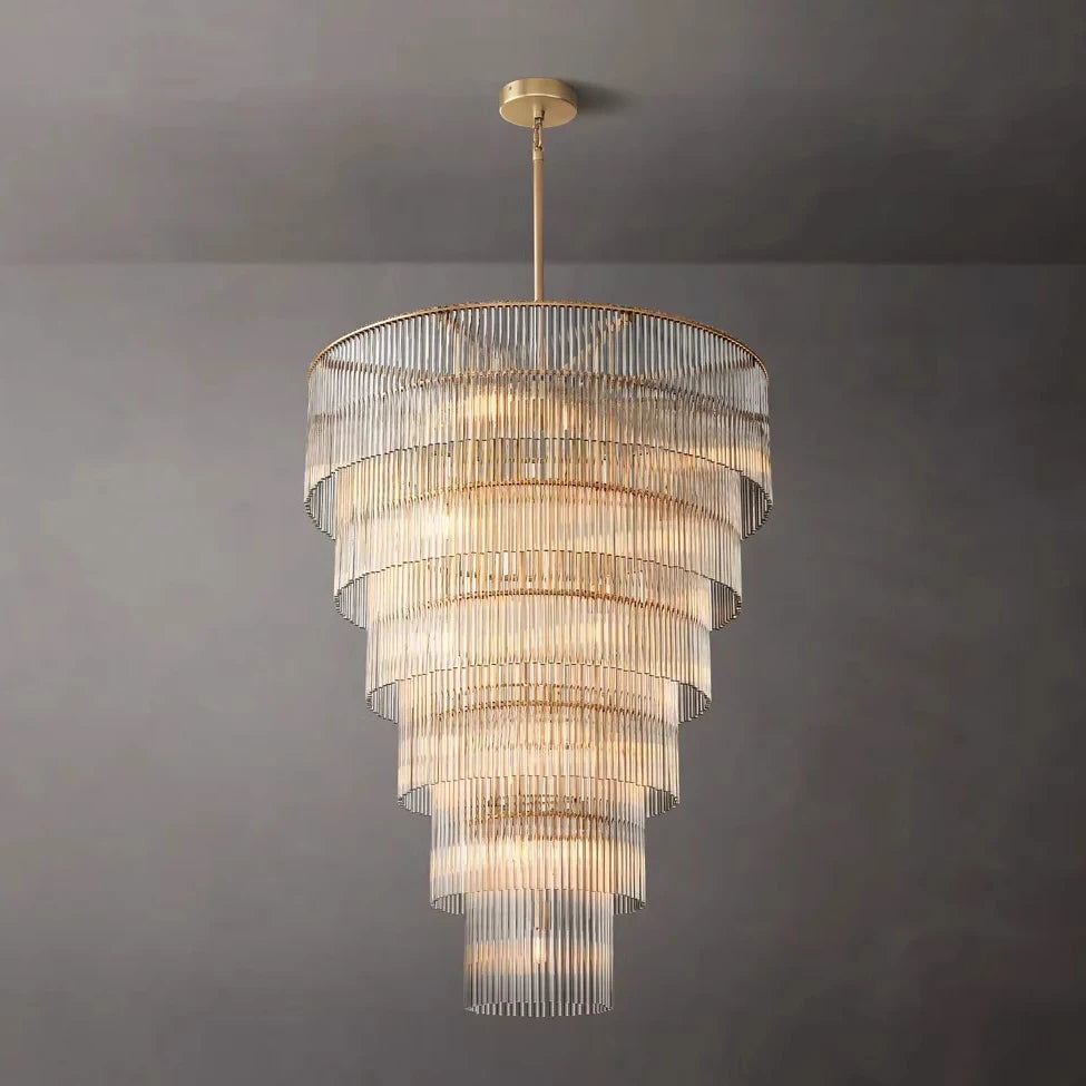 Chandelier with multiple tiers of glass shades on a gray background